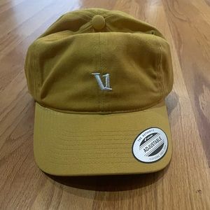 NWT Vuori (Unisex) hat in a mustard color. One size. Adjustable.